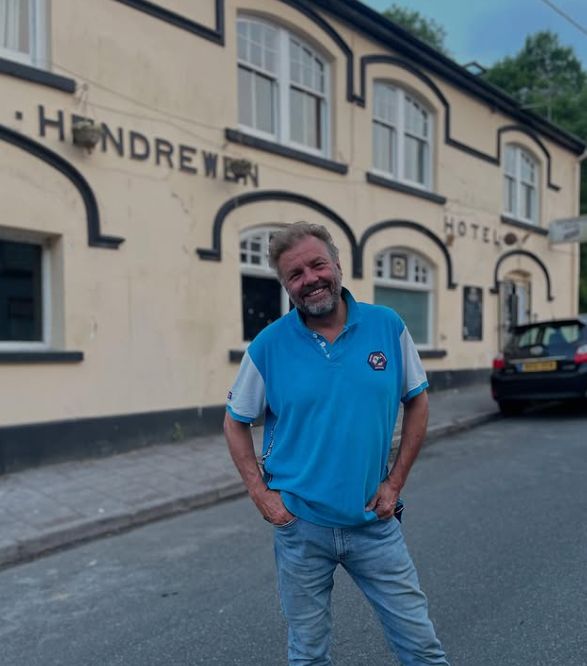 Martin Roberts outside of a pub and hotel