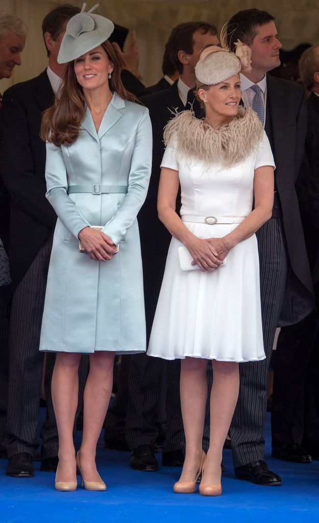kate and Sophie in belted dresses and hats