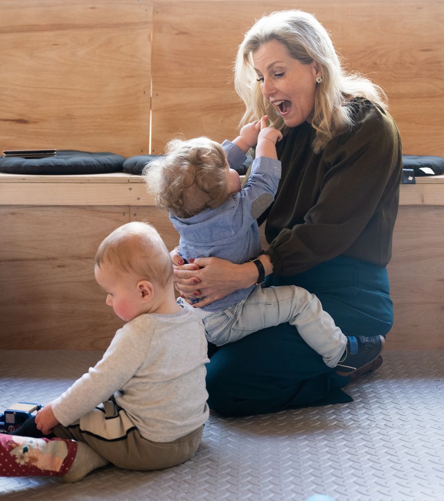 Sophie plays with toddler at play group