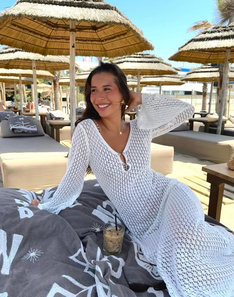 Erling Haaland's partner Isabella in white crochet dress on a beach