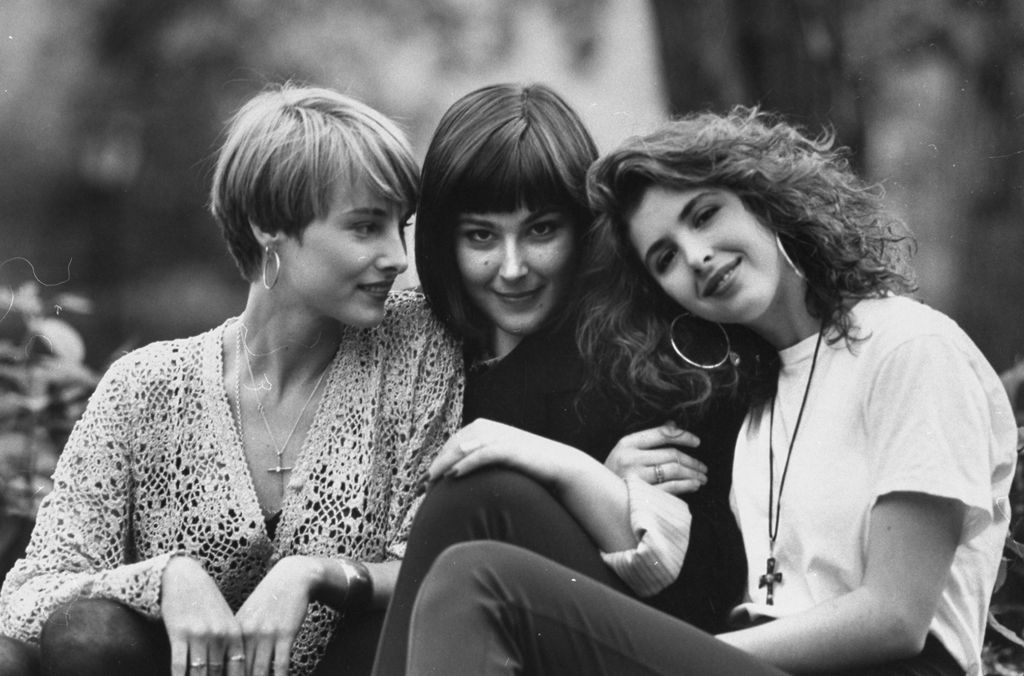 Wilson Phillips singing trio (L-R) Chynna Phillips, Carnie & Wendy Wilson posing together on a rock in the park.    (Photo by Rob Kinmonth/Getty Images)