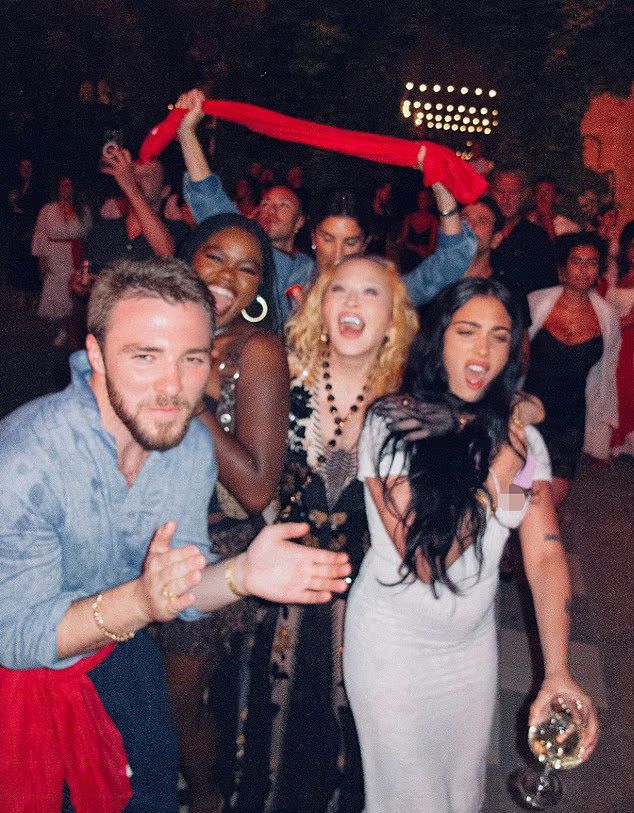 madonna smiling with rocco mercy and lourdes in italy for birthday