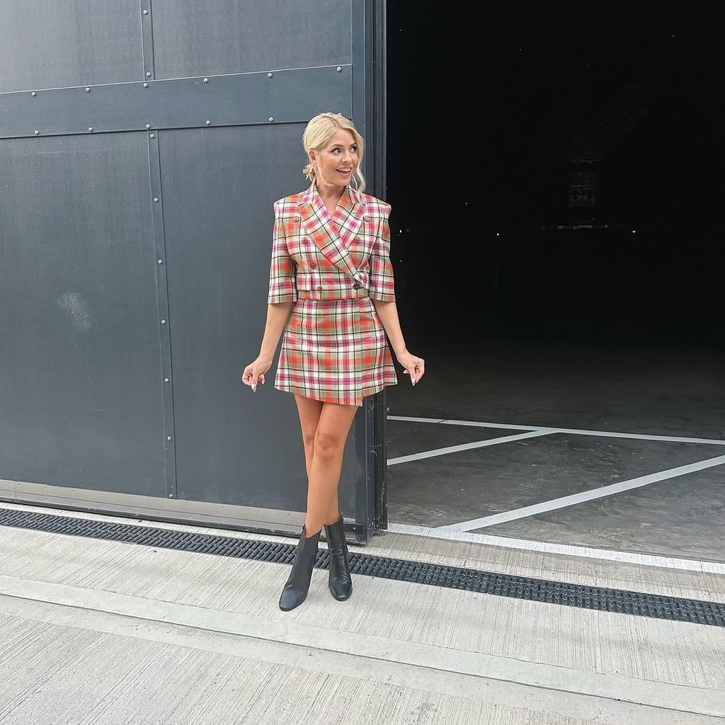 Holly Willoughby wearing a tartan power suit