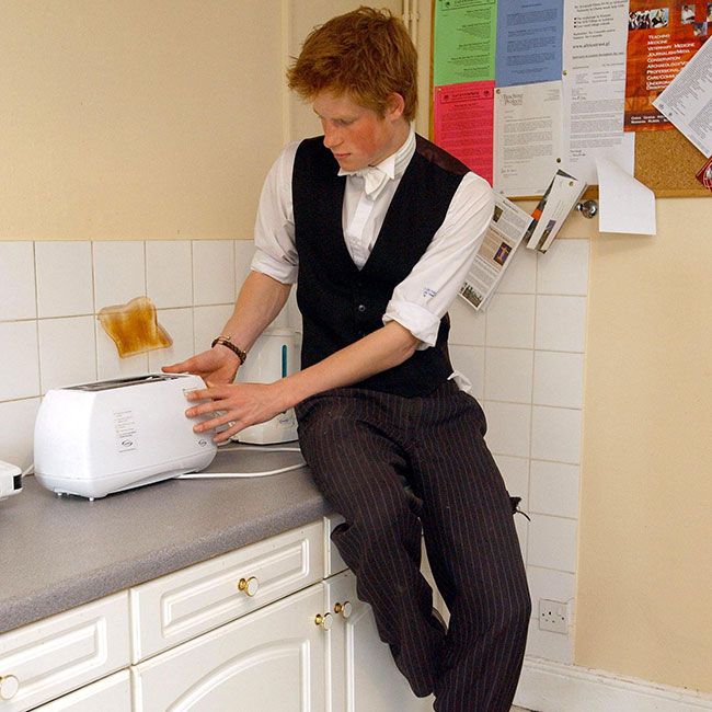 Prince Harry at Eton College making toast