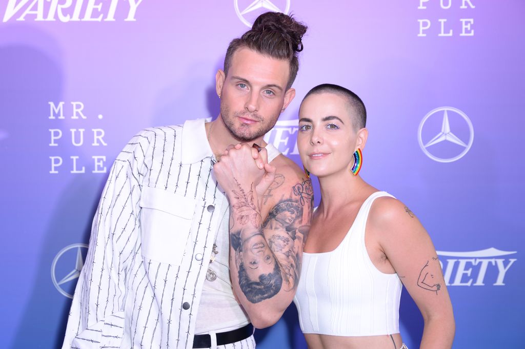 Nico Tortorella and Bethany C. Meyers both dressed in white 