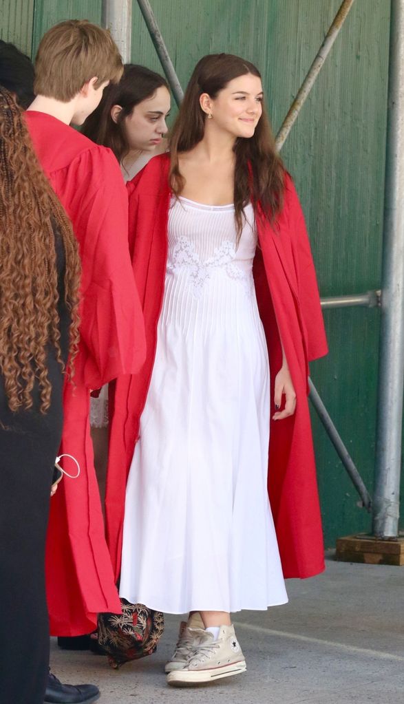 Suri sported a red gown, white dress and Converse sneakers