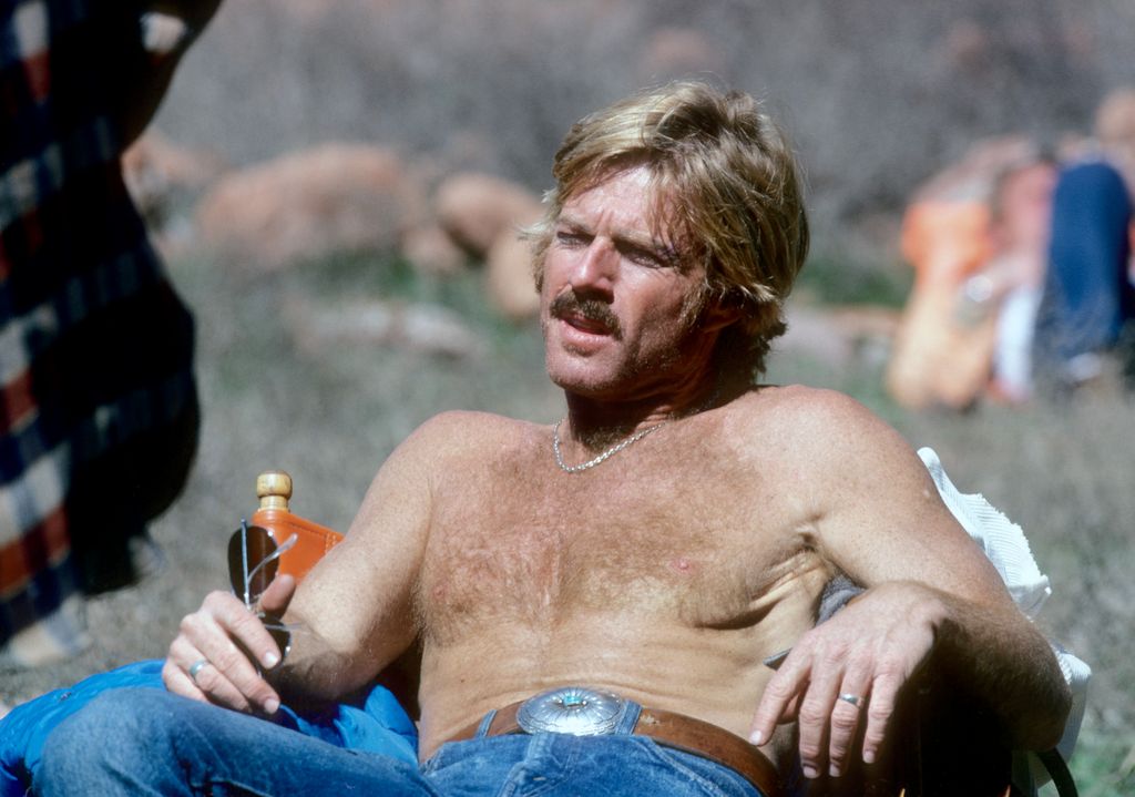 Robert Redford relaxes during the filming of 'The Electric Horseman', directed by Sydney Pollack on March 1, 1979 in Utah