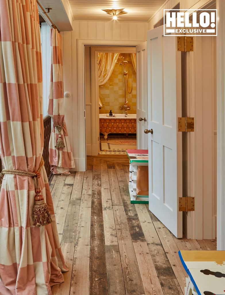 Charlotte and Philip Colbert's hallway with checked pink curtains in East London