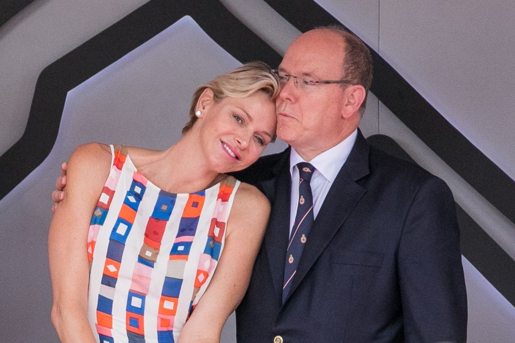 Princess Charlene leaning in for a cuddle with husband Prince Albert