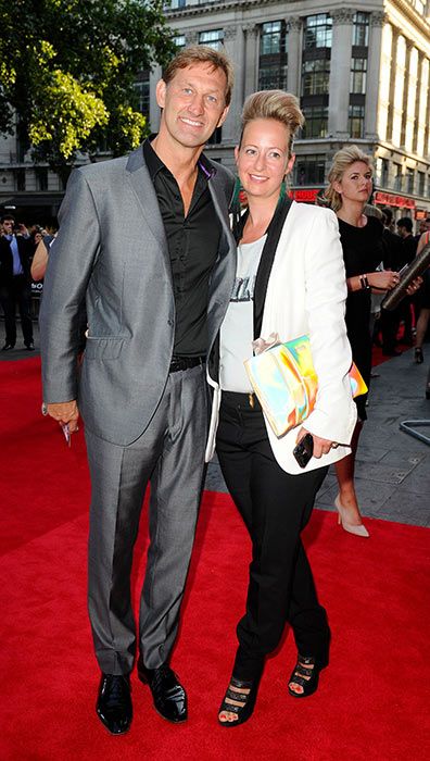 Tony Adams and his wife Poppy pictured on a red carpet back in 2013