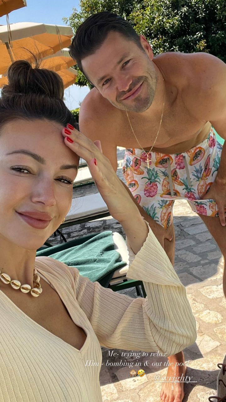 mark and michelle posing for poolside selfie 