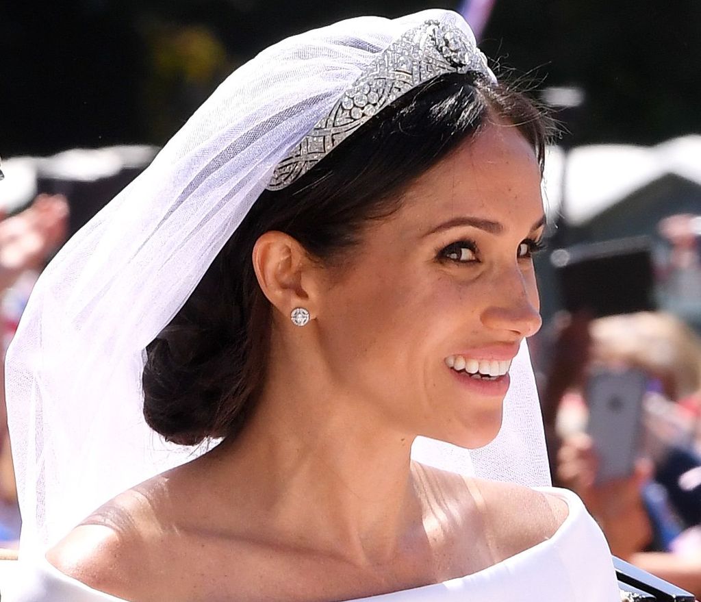 Meghan Markle looking sideways in her wedding tiara and wedding dress