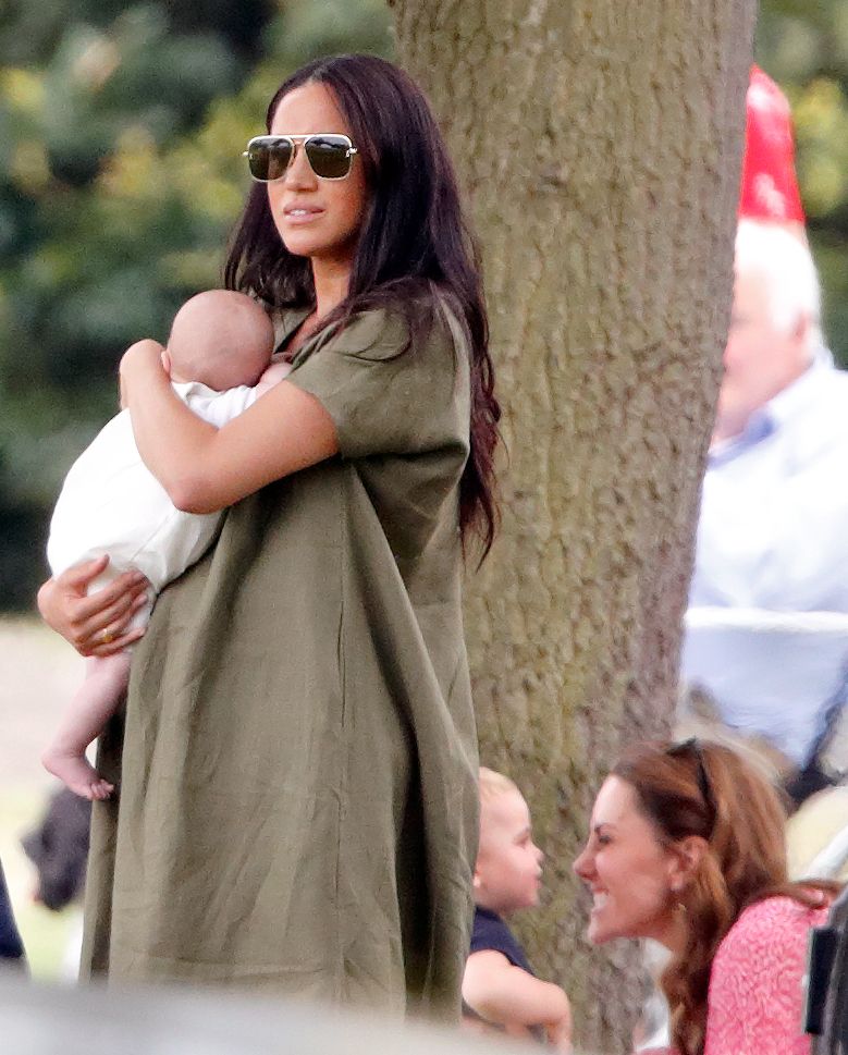 Meghan looked chic in an olive green dress, polo 2019