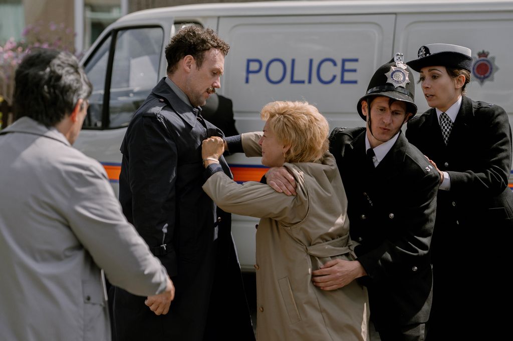 Sheridan Smith as Ann Ming, battling against a police officer and an officer behind her trying to pull her away