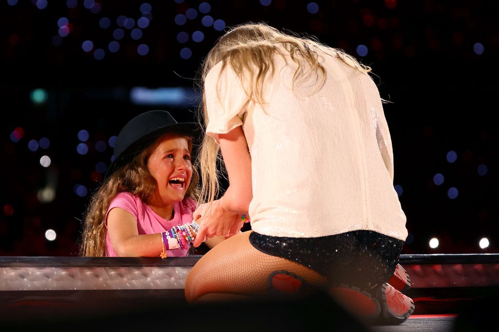 A young fan reacts after receiving a hat from Taylor Swift at Melbourne Cricket Ground 