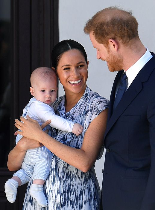 prince harry with meghan markle holding archie