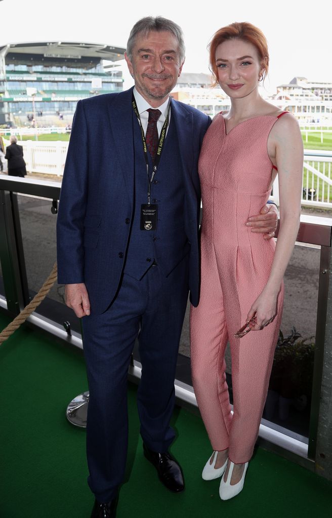 Eleanor Tomlinson and Malcolm Tomlinson pose together next to the racecourse
2018 Randox Health Grand National Festival