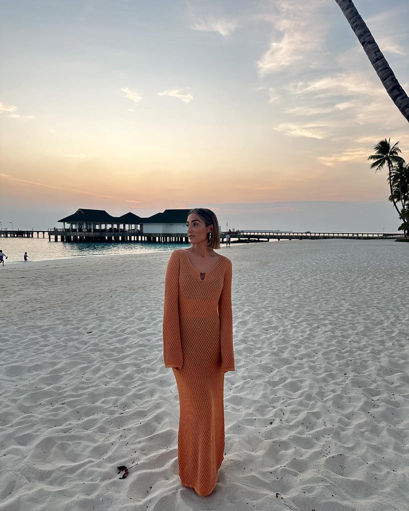 woman wearing orange beach dress 