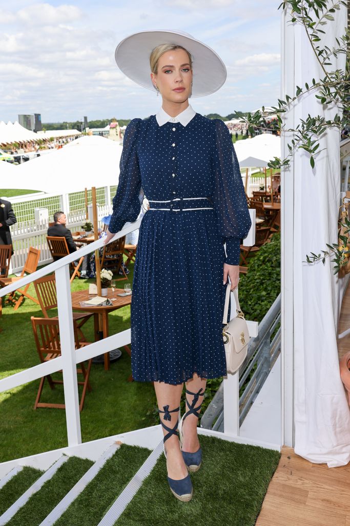 Lady Amelia Spencer in navy and white dress with white hat at Ascot