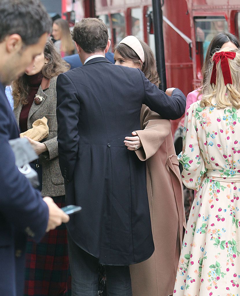 Princess Eugenie and Jack Brooksbank embrace in a crowd of people