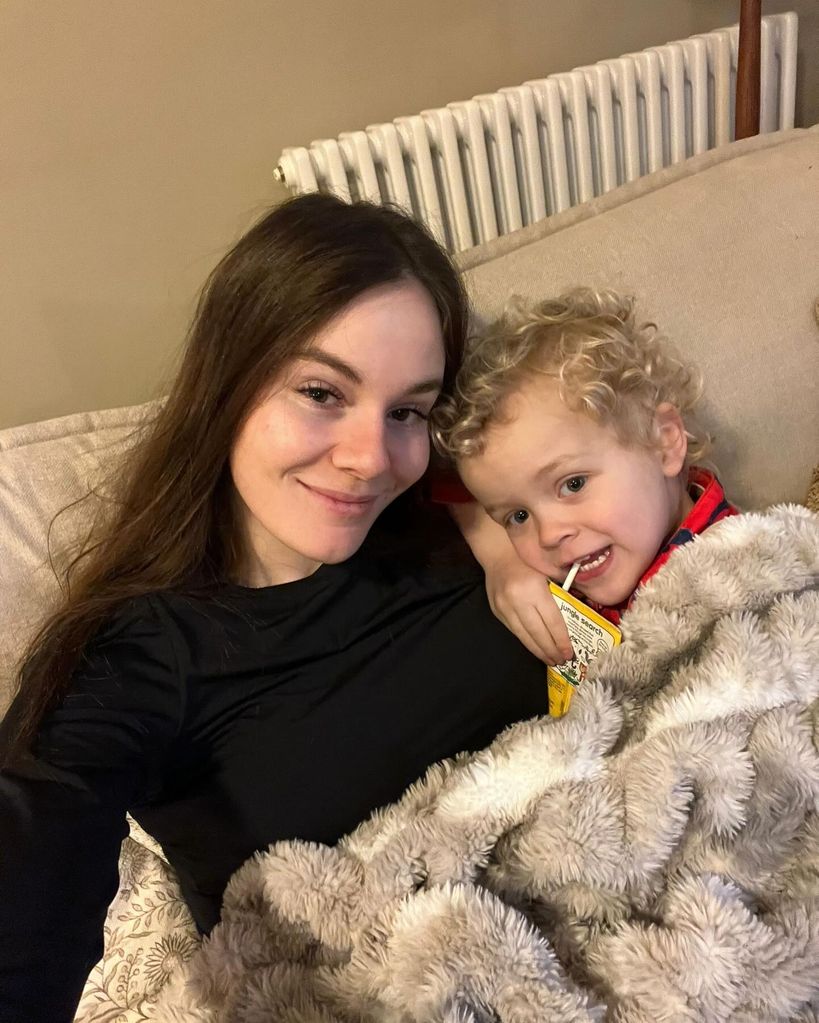 Holly ramsay and stepson George on sofa cuddle