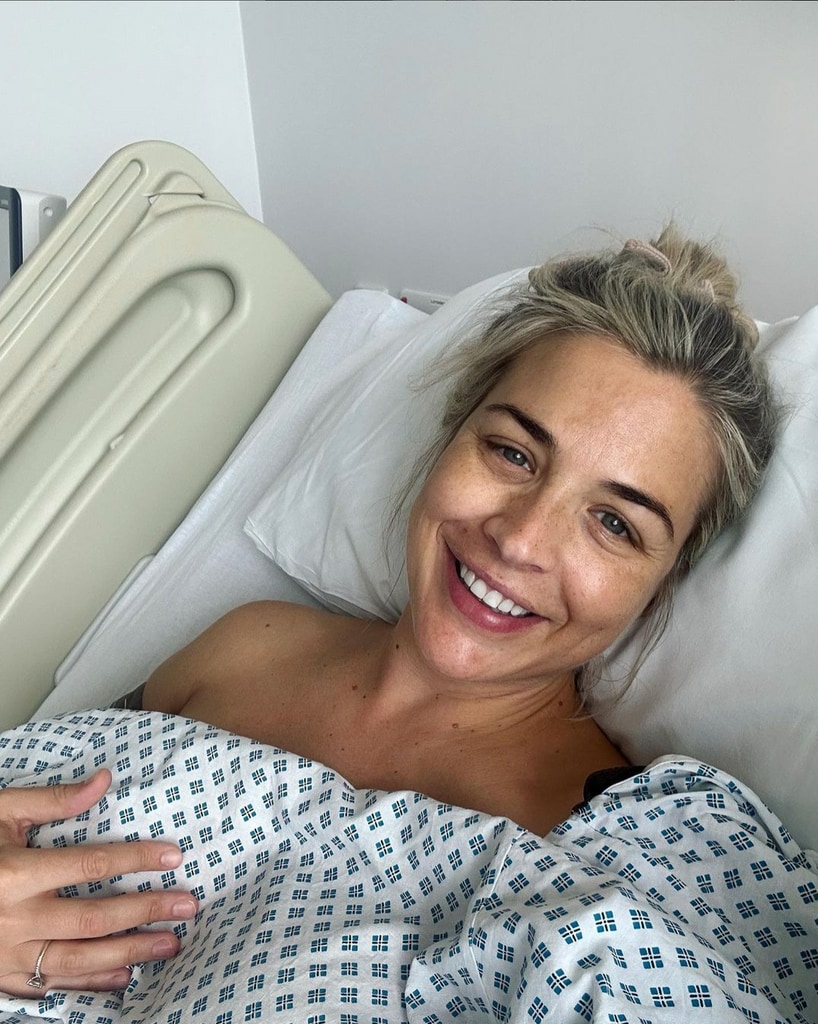 Gemma Atkinson lies in hospital bed smiling