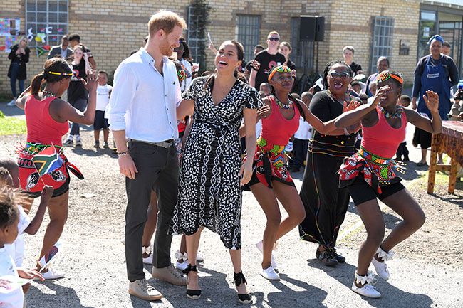 meghan harry laughing after dancing
