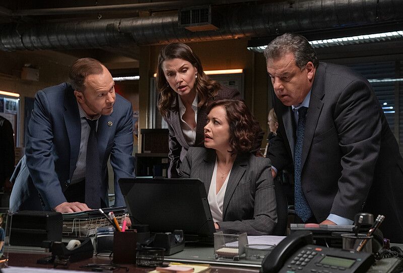 Donnie Wahlberg as Danny Reagan, Bridget Moynahan as Erin Reagan Boyle, Marisa Ramirez as Maria Baez, and Steve Schirripa as Anthony Abetemarco in Blue Bloods