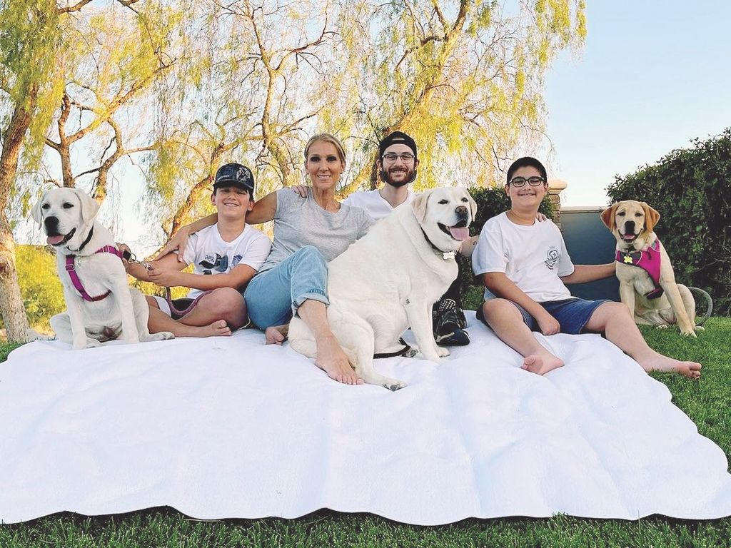 Celine Dion, her boys, and their dogs in happier times.
