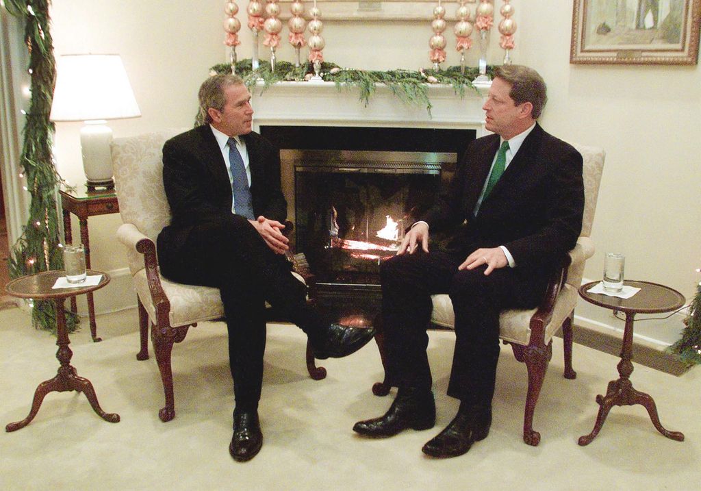 US Vice President Al Gore meets with US President-elect George W. Bush in the living room of the vice president's residence