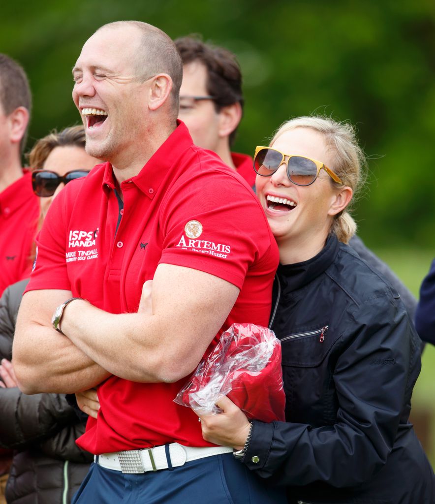 couple laughing at golf event