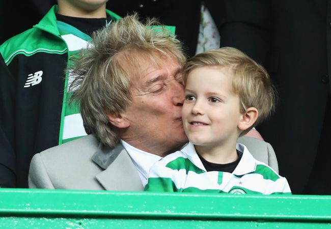rod stewart kissing his young son at a football match 