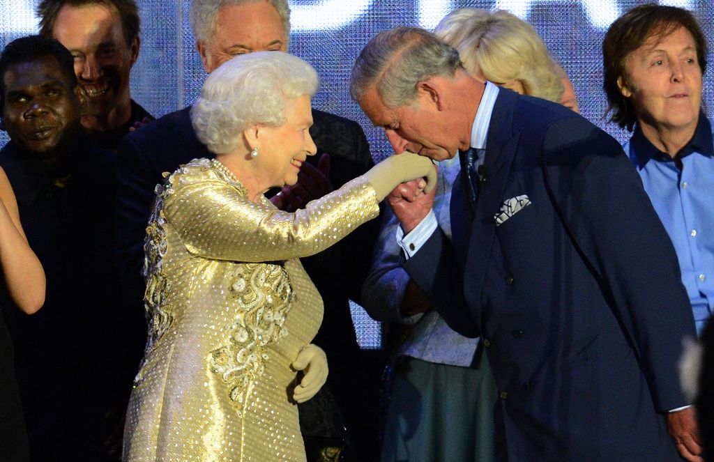King Charles kissing the late Queen's hand