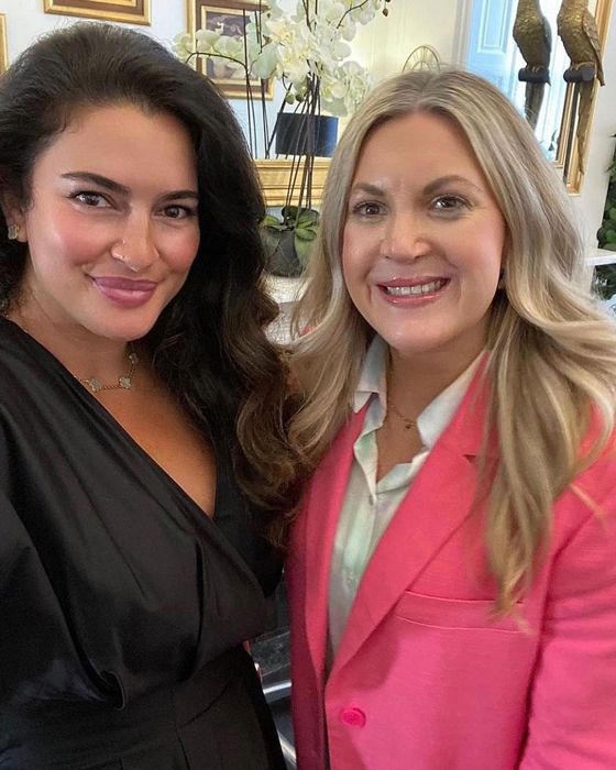 Leanne Bayley wearing a pink blazer, with cosmetic doctor Dr Bibi in silky black dress