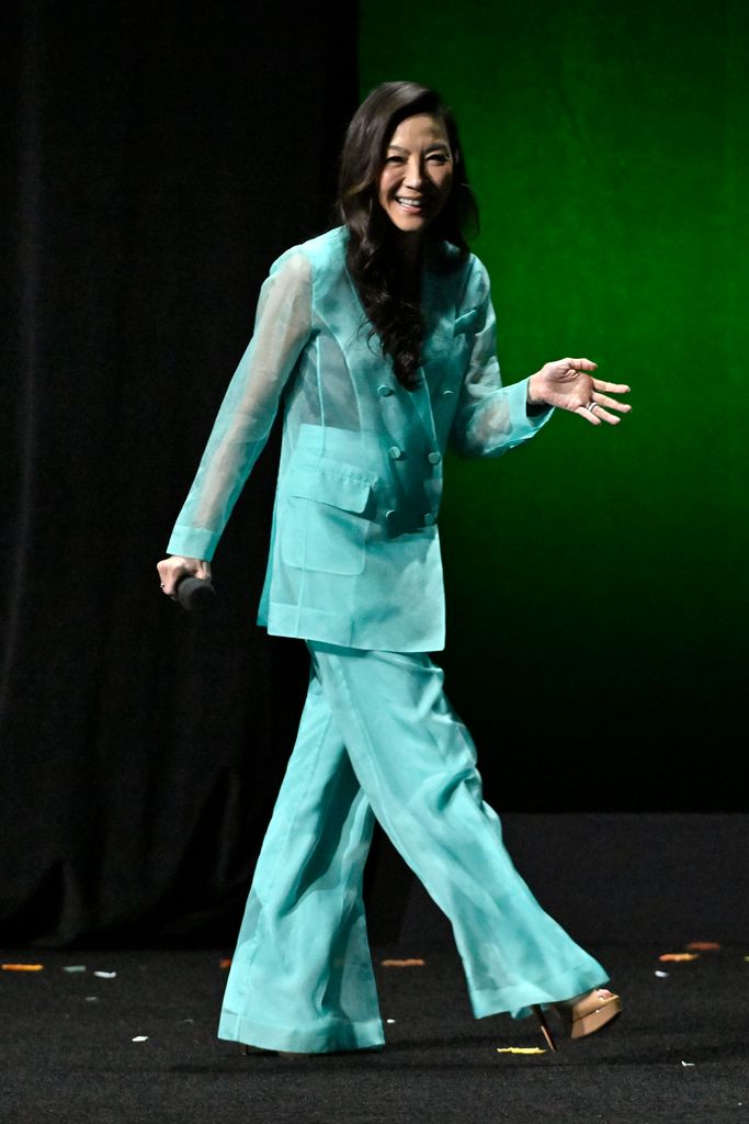 Michelle Yeoh on stage in blue suit