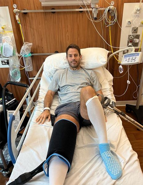 Jamie Redknapp in a hospital bed and knee cast