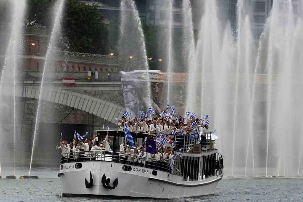 A boat carrying Greek athletes on the River Seine