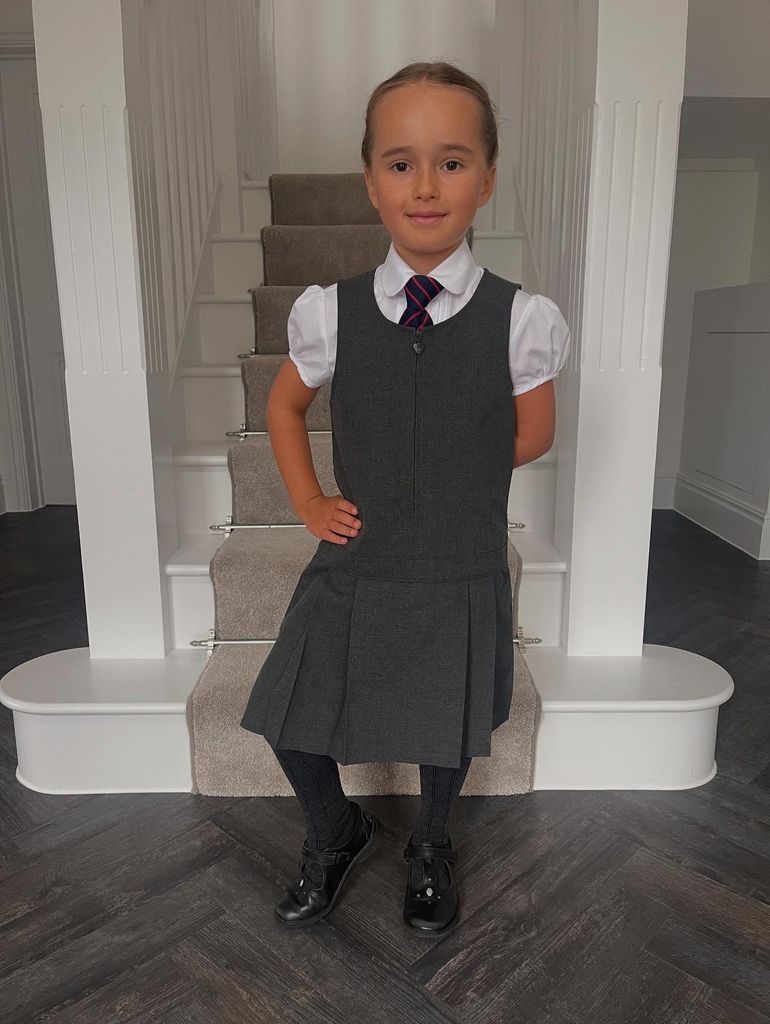 little girl in school uniform