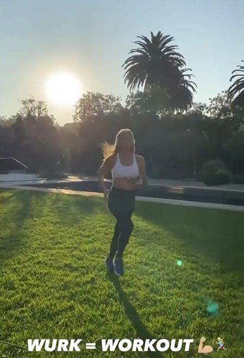 Jennifer Aniston running in her garden