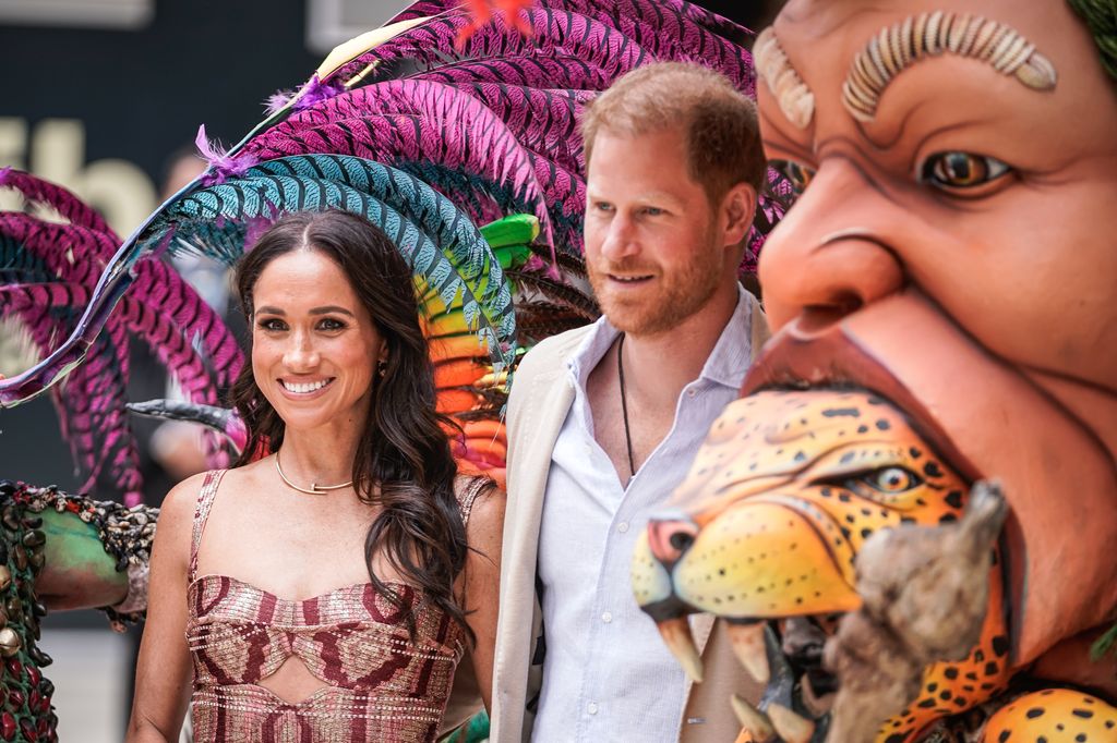 Meghan Markle and Prince Harry smile during their visit to Colombia 