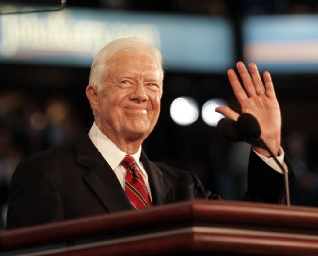Former President Jimmy Carter acknowledges applause during the first day of the Democratic National Convention in Boston, Massachusetts Monday July 26, 2004
