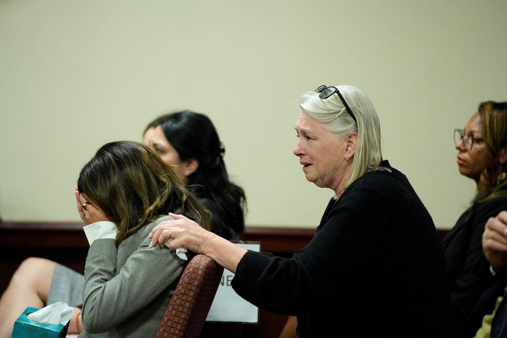 Hilaria Baldwin (L), wife of actor Alec Baldwin, and his sister Elizabeth Keuchler react during his trial on involuntary manslaughter 