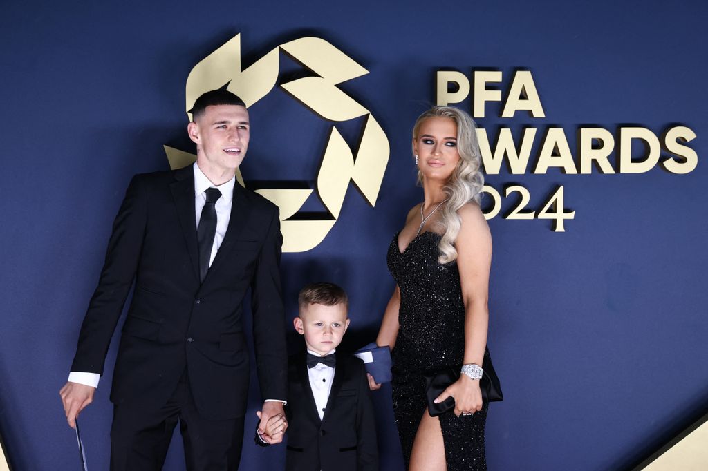 family of three on red carpet