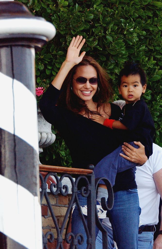 Angelina with Maddox arriving at the 61st Venice Film Festival in 2004 