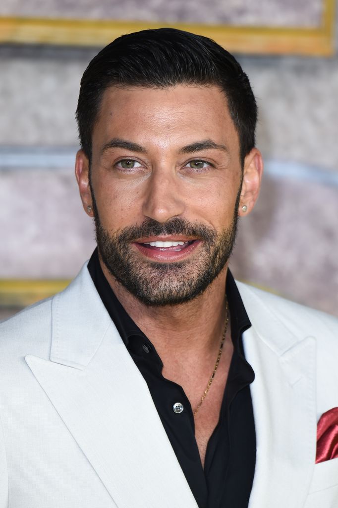 Giovanni Pernice in a white suit on the red carpet