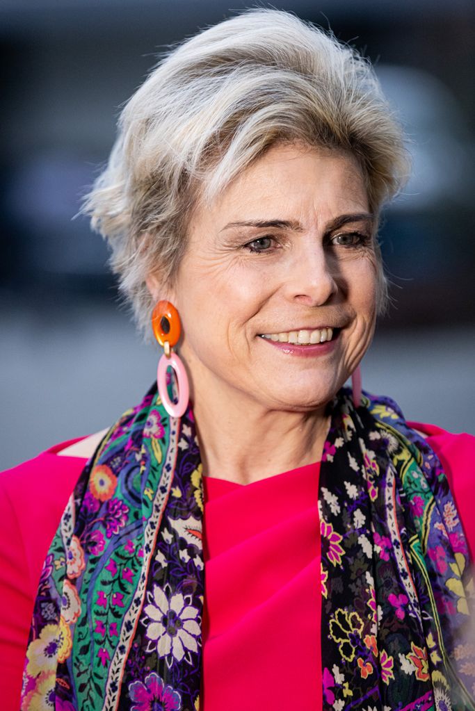 Princess Laurentien in a red dress and colourful scarf