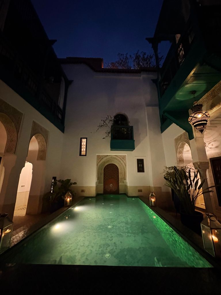 An outdoor pool at night 