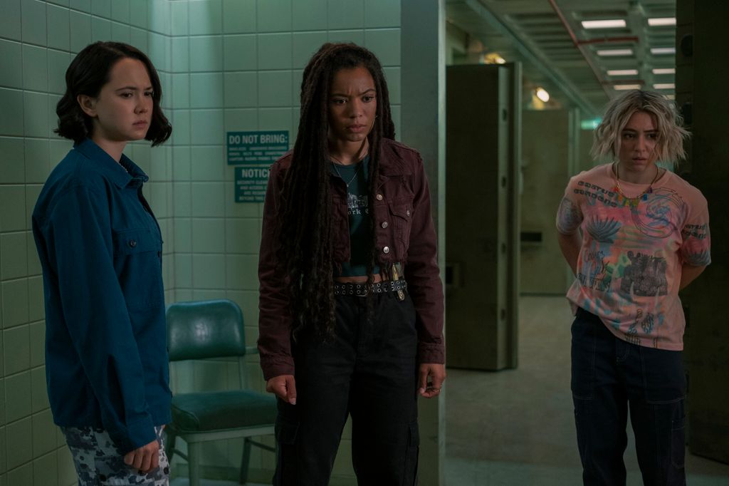 three young women standing in hospital room