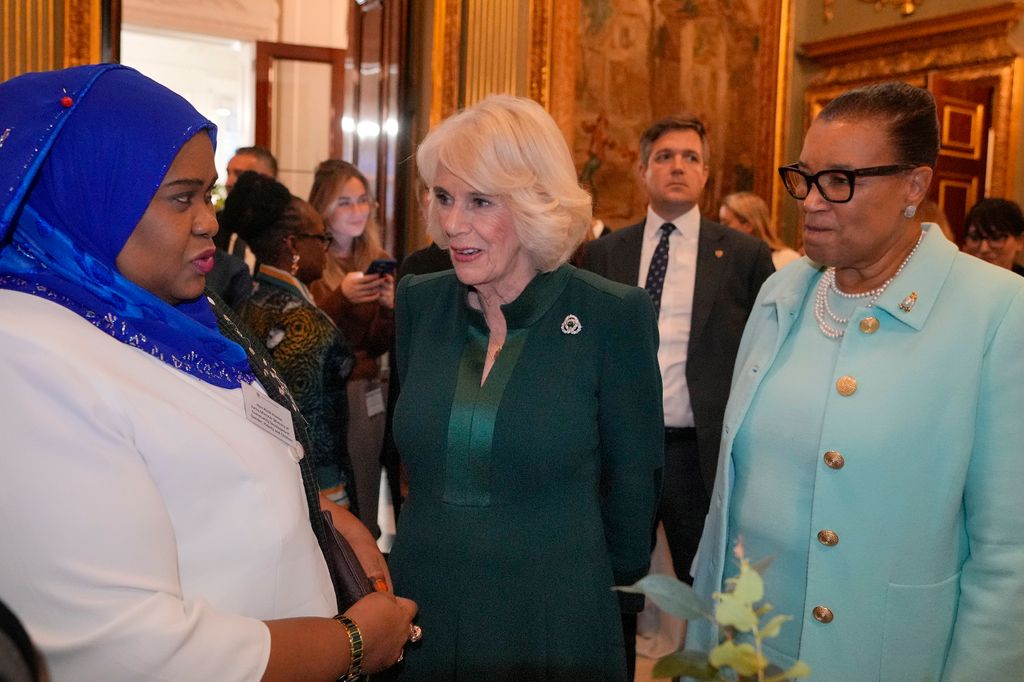 Queen Camilla talks to guests as she attends the Commonwealth Women Leader's event at Marlborough House 