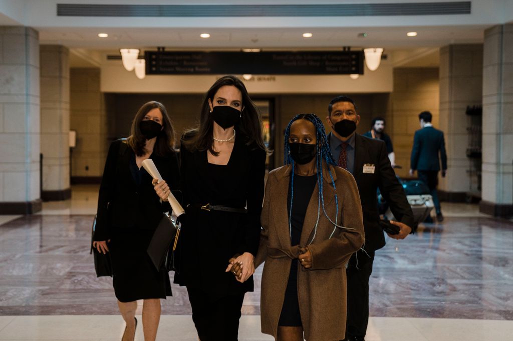 Actress Angelina Jolie walks with her daughter Zahara Jolie-Pitt through the Capitol Visitors Center 